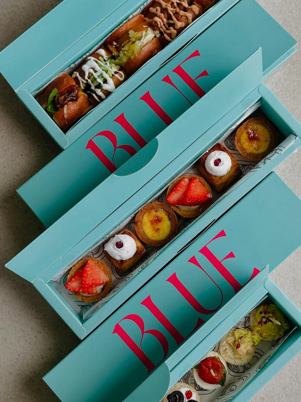 Blue sharing boxes packed with savoury bites